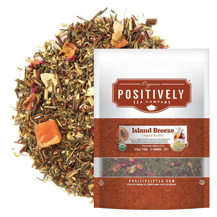 Positively Tea Company Island Breeze Rooibos tea, 16oz bag, displayed with loose leaf blend featuring tropical fruit pieces for a sweet, citrusy flavor.