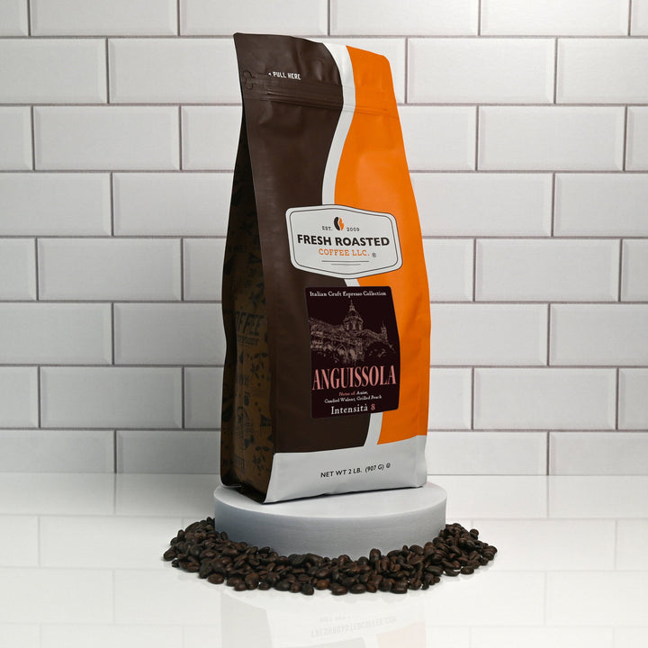 Fresh Roasted Coffee Anguissola espresso beans, 2-pound bag displayed on a white tiled background surrounded by coffee beans.
