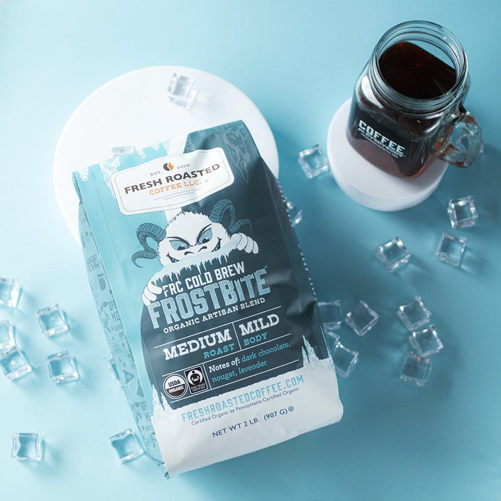 Fresh Roasted Coffee Frostbite Cold Brew with a chilled glass of coffee on ice, medium roast with smooth, mild body.