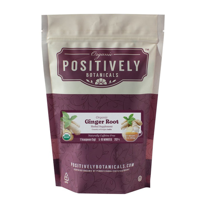 Front view of a 1 lb Positively Botanicals Organic Ginger Root Herbal Supplement pouch with a purple label, USDA Organic seal, and brewing instructions.