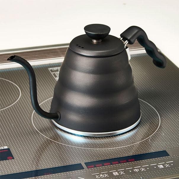 Black Hario V60 Buono Coffee Drip Kettle on a stove.